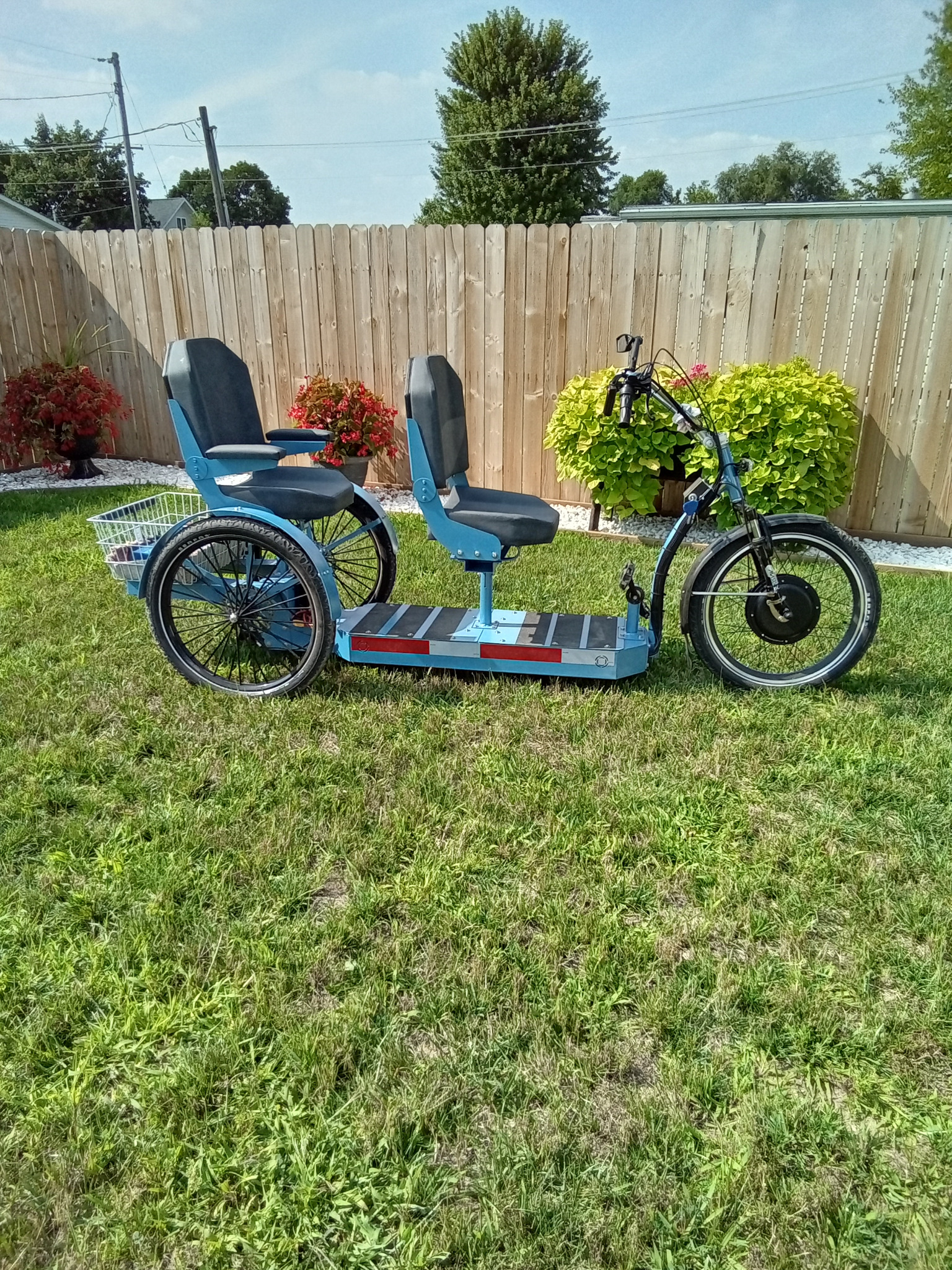 Original photograph of a two-seat Step-On trike